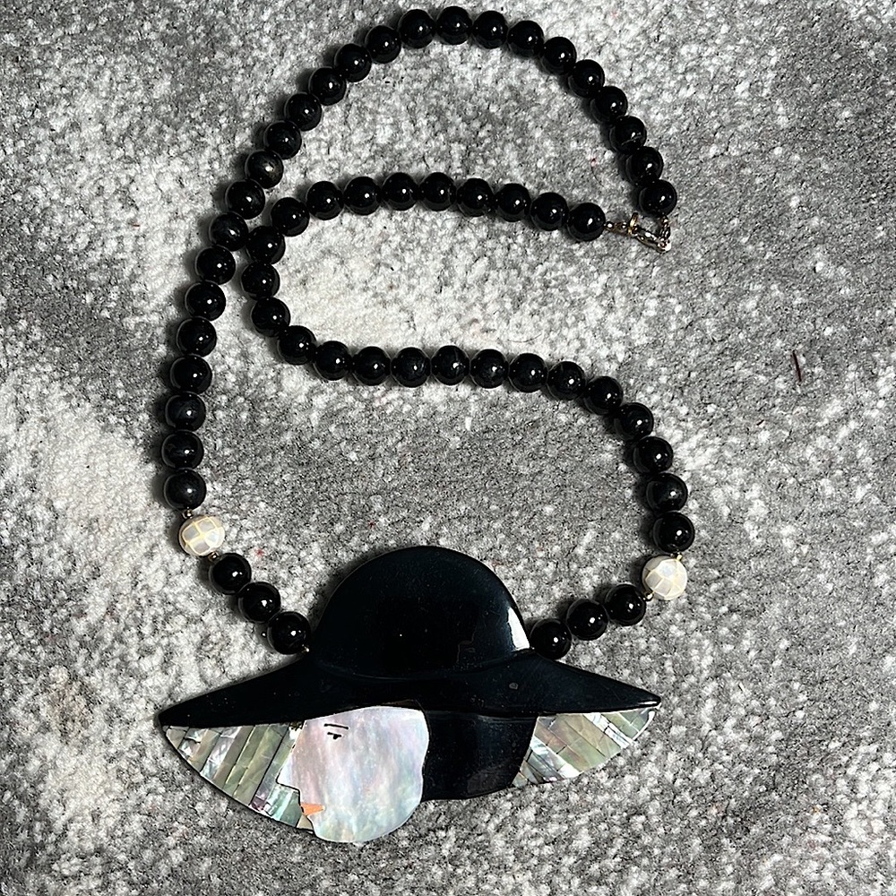Vintage pearl lady head necklace.